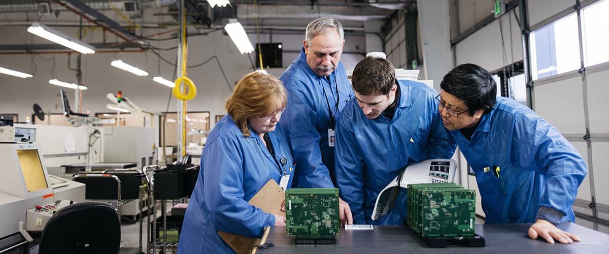 Picture of team reviewing product